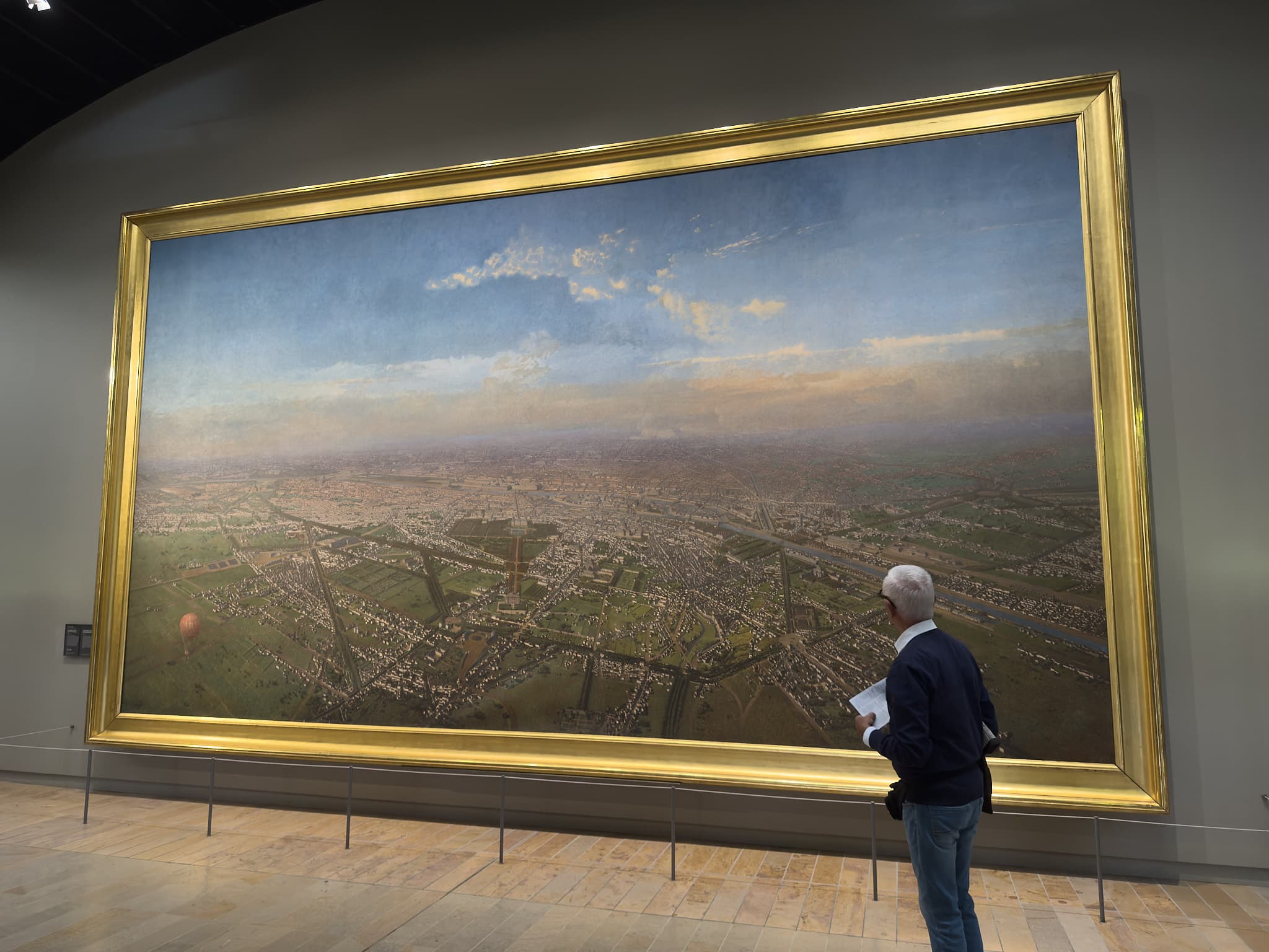 A painting of Paris in the 1800s, the Musee d'Orsay.